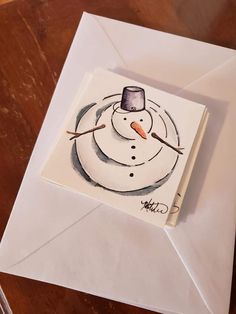 an envelope with a drawing of a snowman on it