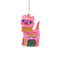 a pink cat ornament hanging from a string