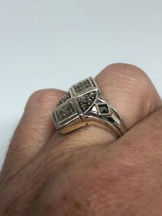 Vintage ring surrounded by Swiss cut fine Marcasite Sterling silver Size 7 can be sized by my jeweler. His service charge is $10-$20 Please request a quote. All rings are shipped free in the US in a nice gift box. Check out our over a THOUSAND great reviews Engraving is $4 per letter and is not always perfect depending on the piece. It can take a few days if the jeweler is busy. This is payable to Paypal Judithsltd@gmail.com Vintage Sterling Silver Rings With Diamond Accents, Classic Marcasite Jewelry For Anniversary, Vintage Silver Diamond Ring With Gemstone, Antique Silver Cluster Ring As Gift, Marcasite Anniversary Rings Stamped 925, Silver Cluster Ring With Stone Setting For Anniversary, Marcasite Ring For Anniversary, Vintage Silver Diamond Ring With Accent Stones, Vintage Silver Cluster Ring With Diamond Accents