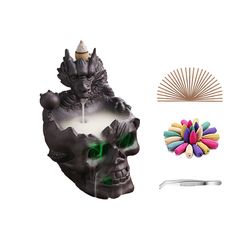 an image of a skull with green eyes and hair combs next to other items