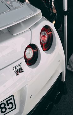 the back end of a white sports car