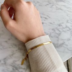 Minimal and classic gold herringbone bracelet. This dainty bracelet is your go to every-day jewelry. You can wear it alone or layer it with other gold bracelets. A perfect addition to your jewelry collection! ………………………………….D E T A I L S• Materials: Stainless steel, 18k gold plating.• Length: 6 inches (15.2 cm) + extension 1.5 inches (3 cm)• Width: 3 mm• This product is hypoallergenic, water and tarnish resistant Gold Minimalist Tarnish-resistant Bracelets, Minimalist Gold-tone Tarnish Resistant Bracelets, Chic Tarnish Resistant Gold-tone Bracelet, Everyday Tarnish-resistant Gold Snake Chain Bracelet, Everyday Gold Snake Chain Bracelet, Tarnish Resistant, Thick Gold Hoop Earrings, Delicate Gold Bracelet, Herringbone Bracelet, Chunky Gold Hoop Earrings