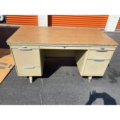 an old wooden desk with two drawers