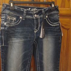 40 Inches Long, Wallflower Jeans, Size 7, Waist Is 15. Dark Blue With Rhinestones On Back Of Pockets. Excellent Condition, No Stains Or Holes. Smoke And Dog Free Home. Wallflower Jeans, Khaki Jeans, Western Jeans, Curvy Jeans, Juniors Jeans, Maternity Jeans, Boot Cut Denim, Levis Women, Miss Me Jeans