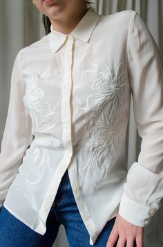 Truly exquisite, white pure silk oriental embroidery long sleeve button up blouse by Hobbs London. Made out of great quality silk.  RRP price is 225. Fabrics: 100% silk Tag size:  UK 8 Brand: Hobbs  Best fits: XS - S Condition: superb, no flaws MEASUREMENTS *taken seam to seam. not doubled, taken flat Shoulders: 38 cm | 14.9" Bust: 45 cm | 17.7" Sleeve length: 61 cm | 24" Length: 64 cm | 25.1" For reference, our model is size S and is 5"2 tall  SHIPPING Sent as Latvian Standard Post. Includes tr Elegant Cream Blouse With Intricate Embroidery, Elegant Cream Top With Floral Embroidery, Elegant Blouse With Tonal Embroidery For Spring, Elegant Summer Blouse With Intricate Embroidery, Elegant Spring Blouse With Tonal Embroidery, Formal Long Sleeve Tops With Intricate Embroidery, Elegant Cream Tops With Intricate Embroidery, Fitted Elegant Blouse With Floral Embroidery, Elegant Embroidered Button-up Blouse