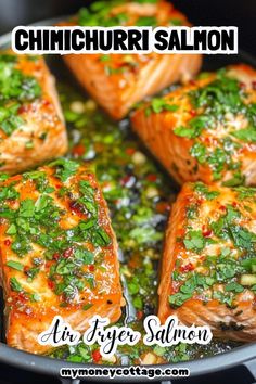 salmon fillets in a skillet with herbs and seasoning on top for an air fryer recipe