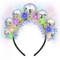 PRICES MAY VARY. Exquisite Design:Halloween Light Up Disco headband is a work of art, meticulously crafted with an array of five dazzling disco balls and adorned with the most exquisite glitter fabric. The result is a headpiece that shimmers and shines under various lighting conditions, enhancing your allure and making you the center of attention wherever you go. Durability and Comfort for Long-Term Use: Each disco ball on the headband measures 2 cm or 0.78 inches in diameter, designed with a to Disco Christmas Party, Disco Headband, Mha Christmas, Disco Fever Party, Disco Christmas, Vintage Disco, Retro Disco, Halloween Headband, Christmas Birthday Party