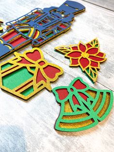 some cut outs are laying out on the table to be used as ornaments for christmas decorations