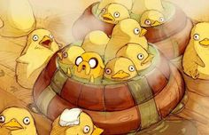 a bunch of little yellow chicks sitting in a wooden barrel with their heads turned to the side