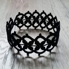 Minimalist style black crochet Gothic lace choker necklace is tied with a black button. A simple yet elegant accessory that will work well with a lot of looks.  Made from 100% high-quality mercerized cotton. Choker length 35 cm / 13,8 inches, width - 4,5 cm / 1,8 inches. When ordering, you can make a note of a custom neckline length if you would like. It can be made also in different colours, but keep in mind that this might push the date when the item is shipped out back by a few days. Check ou Minimalist Handmade Black Choker, Elegant Handmade Black Choker, Adjustable Black Fantasy Choker, Adjustable Black Choker, Crochet Gothic Choker Patterns, Elegant Black Lace Choker, Black Victorian Choker Necklace, Black Lace Necklace, Lace Choker Necklace