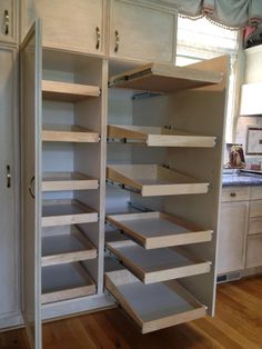 an empty pantry with lots of shelves in it