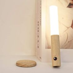 a wooden light that is on top of a table