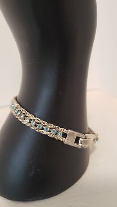 Shipping Continues with Stallion Express...Vintage Silver Tone Bracelet with Single row of Baby Blue Rhinestones.  Excellent costume piece.  Centre row of blue rhinestones in the middle of silver tone frame. 8 inches ---------------------------------------------------------------------------- For More of Our Jewelry that includes Authentic Cameos, Earrings and a nice selection of Costume Vintage Pieces https://www.etsy.com/ca/shop/TarPaperAlley?ref=seller-platform-mcnav&section_id=24631960 ----- Adjustable Blue Bracelets With Sparkling Stones, Blue Adjustable Charm Bracelet For Party, Adjustable Blue Charm Bracelet For Party, Adjustable Blue Charm Bracelet For Parties, Blue Crystal Bracelet With Rhinestones, Blue Rhinestone Crystal Bracelet For Party, Blue Crystal Bracelet With Rhinestones For Party, Blue Crystal Bracelet With Sparkling Stones, Blue Charm Bracelet For Party