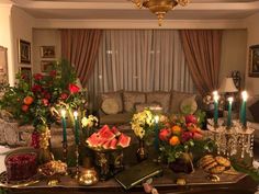 a living room filled with lots of furniture and candles