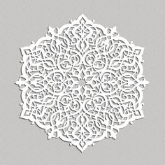 a paper cut out of an intricate design