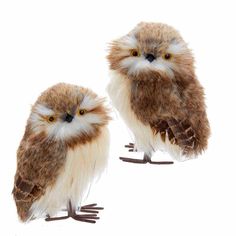 two stuffed owls sitting next to each other