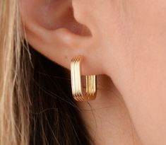 Our square hoop earring is 14k solid gold. It will accompany you every day and everywhere with minimalist style. The closure of our gold hoop earring is very comfortable and it does not disturb you at all. If you think of it as a gift, it will be a perfect gift for your loved ones on mother's day, birthdays, valentine's day, anniversaries, or graduations. 🎁 If you want you can add a gift note for your loved ones. It arrives in a special jewelry gift box. ✨ We respond to your questions happily. Chunky Minimalist Earrings, Modern Hoop Earrings As Gift, Modern Hoop Earrings For Gift, Modern 14k Gold Huggie Earrings Gift, Rectangular Yellow Gold Huggie Earrings Gift, Rectangular 14k Gold Huggie Earrings As Gift, Modern Yellow Gold Hoop Earrings Gift, Modern 14k Gold Hoop Earrings As Gift, Thick Gold Hoops