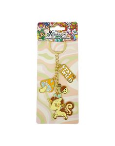 a keychain with cartoon characters on it's front and back ends in gold