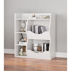 a white book shelf with books on it