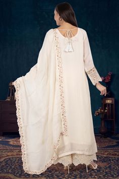 Indulge in elegance with our Partywear Suit D-242. Adorned with exquisite pearl and floral thread embroidery, this suit exudes sophistication and luxury. Elevate your style and make a statement at any special occasion with this premium piece. Elegant Off White Dupatta For Reception, Elegant Off-white Dupatta For Reception, Anarkali Suits With Dupatta For Eid, Floral Embroidered Chinon Set For Reception, Chikankari Embroidery Semi-stitched Suits For Eid, Elegant Traditional Wear With Sheer Dupatta For Reception, Formal Georgette Sets With Intricate Embroidery, Semi-stitched Anarkali Suit With Dupatta, Traditional Floral Embroidered Palazzo Set For Wedding