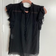 Balenciaga Blouse Black Silk Top With Ruffles, Black Silk Ruffled Top, Black Silk Tops For Daywear, Black Sleeveless Blouse For Daywear, Black Silk Short Sleeve Blouse, Black Silk Summer Blouse, Black Silk Blouse For Summer, Black Ruffled Blouse For Daywear, Black Silk Blouse For Office