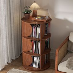 there is a book shelf with many books on it and a lamp next to it