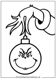 a christmas ornament with an angry grin on it