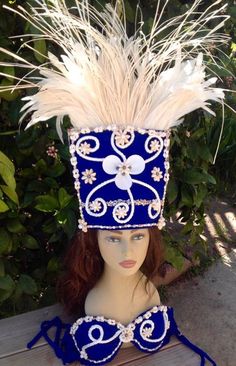 "This is a sample of what we can make for you. All Costumes are made to order! OPTION-- You can also change the feathers to any dyed solid color. NOTE- That the headpiece is with all white feathers, white feathers a little more, please message us if you like to change to any other dyed feathers. Headpiece height approximately 21\" tall. Feathers measures- 8\"- 10\" long LISTING- ONE FRINGE LESS SARONG. ONE HEADPIECE ONE BRA TOP ONLY! NOTE- PLEASE DON'T FORGET YOUR BRA SIZE AND HEAD SIZE. When yo Tahitian Headpiece, Ray Costume, Tahitian Costumes, One Year Pictures, Costume Inspo, Manta Ray, Dance Routines, Head Piece, White Feathers