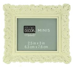 a white photo frame with the words studio decor minis on it's side