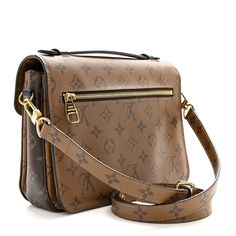 This is an authentic LOUIS VUITTON Reverse Monogram Pochette Metis. This chic handbag is finely crafted of Louis Vuitton monogram toile canvas. The bag features a lighter brown canvas flap and back, a black leather strap handle, an optional adjustable light brown monogram canvas shoulder strap, a rear exterior zipper pocket, and a V-shaped front flap with a brass S-lock. The flap opens to a partitioned black microfiber interior. Louis Vuitton Monogram Bag, Louis Vuitton Pochette Metis, Louis Vuitton Crossbody Bag, Black Leather Top, Louis Vuitton Crossbody, Louis Vuitton Empreinte, Louis Vuitton Pochette, Handbag Outlet, Monogram Bag