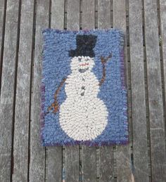 a rug with a snowman on it