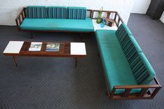 a living room with couches and tables in the middle of carpeted flooring