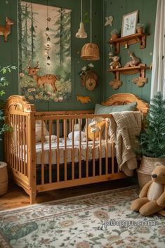 a baby's room with green walls and wooden furniture