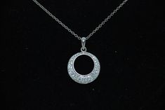 Pretty silver pendant with CZ stones and moon hole to inside all supported by silver chain necklace.  Pendant is 23mm in diameter, height is 26mm and chain is 46cm in length and total wt is 5.44g Silver Circle Necklaces With Diamond Accents, Silver Circle Necklace With Diamond Accents, Silver Open Circle Jewelry With Brilliant Cut, Silver Jewelry With Brilliant Cut Open Circle, Silver Jewelry With Brilliant Cut In Open Circle Shape, Silver Hallmarked Pendant Diamond Necklace, Silver Hallmarked Diamond Pendant Necklace, Sterling Silver Open Circle Necklace With Diamond Accents, Silver Diamond Open Circle Necklace