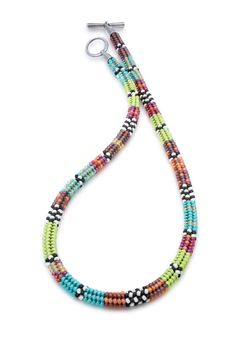 a multicolored beaded necklace on a white background with a clip in the middle