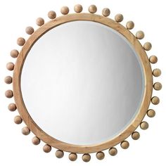 a round mirror with wooden balls around it