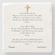 a white plaque with a cross on it and the words grace before meal written in gold