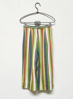 "* High-waisted mod capris c 1960s * Cotton-Linen blend fabric * Wide and narrow stripes in white, puce, gray, green and red * Wide legs have 2\" side slits at hem * Center back zipper closure Label: Rosewood - California Excellent condition Waist: 22 Hip: 36 Inseam: 13 Outseam: 25 Width at Hem: 15 Garments are flat-measured. Please compare these measurements to another flat-measured garment that fits you correctly for size comparison. Don't forget to leave room for body movement. Please view my Pedal Pushers, How To Iron Clothes, Trousers Women, Cotton Linen, Linen Blend, Happy Shopping, Capri, 1960s, Vintage Outfits