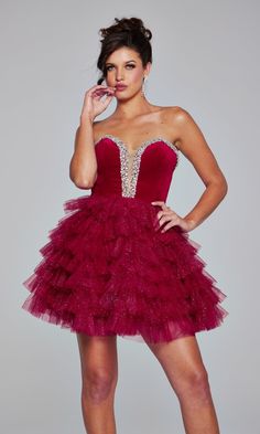 Uniquely fabulous, this strapless short glitter homecoming dress 40352 is a real stunner. The strapless short designer dress from Jovani features a bead-trimmed plunging v-neckline on the soft velvet bodice that wraps around to the open back. The strapless short party dress has a short a-line skirt with glittery ruffles that flow to the hem in tiers for a playful look at homecoming, cocktail parties, and other semi-formal events. A glorious statement piece for your memorable evening, this strapl Strapless Sparkling Mini Dress For Prom, Strapless Glitter Mini Dress For Cocktail, Strapless Contrast Sequin Mini Dress For Homecoming, Black Glitter Dress Short Strapless, Strapless Contrast Sequin Cocktail Mini Dress, Glitter Homecoming Dress, Cute Hoco Dresses, Junior Party Dresses, Short Party Dress