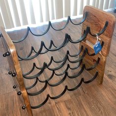 a wine rack made out of wood and metal