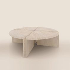 a round table with two sections cut out to show the same size as it sits on a plain surface