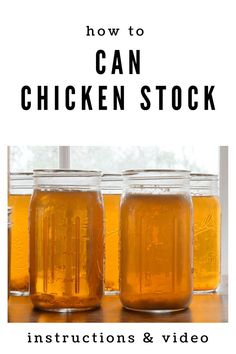 three jars filled with honey sitting on top of a table