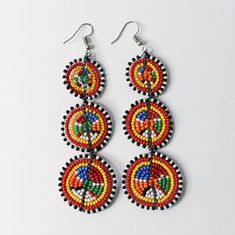 Hand crafted beaded earrings, featuring three vibrant circles that add a pop of color to any outfit. At 3 inches long and 1.25 inches wide, they make a statement without overwhelming your look. Perfect for beach trips, summer getaways, evening parties, and as thoughtful gifts for bridal parties or birthdays. Elevate your style with these versatile and eye-catching earrings! Summer Vacation Beaded Earrings, Multicolor Earrings, Bridal Parties, Beach Trips, Summer Accessories, Beaded Earrings, Bead Work, Color Splash, Thoughtful Gifts