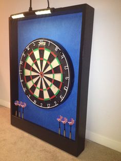 a dart board with four darts in it