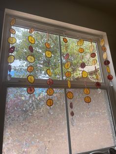 the sun is shining through the window with glass beads hanging from it's sides