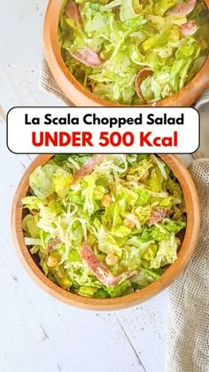 two bowls filled with salad sitting on top of a table