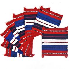 six red, white and blue striped scarves on a white background with one folded