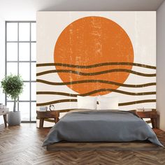 an orange sun over the ocean wall mural in a bedroom with wood flooring and white walls