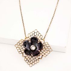 This vintage style pendant necklace is featuring black enameled flower, brass filigree, clear glass crystal and delicate antique polished brass chain. Flower shape is hand cut from copper sheet, shaped and then enameled using torch fired enamel. Flower, sparkly crystal and brass filigree are then layered to form a pendant and then it is attached to delicate brass chain. Very elegant, classy and feminine design Black color on flower is achieved by dipping it into black glass powder at very high t Torch Fired Enamel, Brass Filigree, Filigree Necklaces, Copper Sheets, Flower Vintage, Chain Extenders, Enamel Flower, Feminine Design, Dressy Outfits