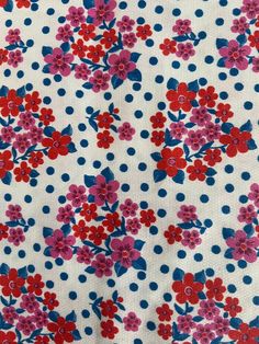 red and blue flowers on white fabric with polka dots